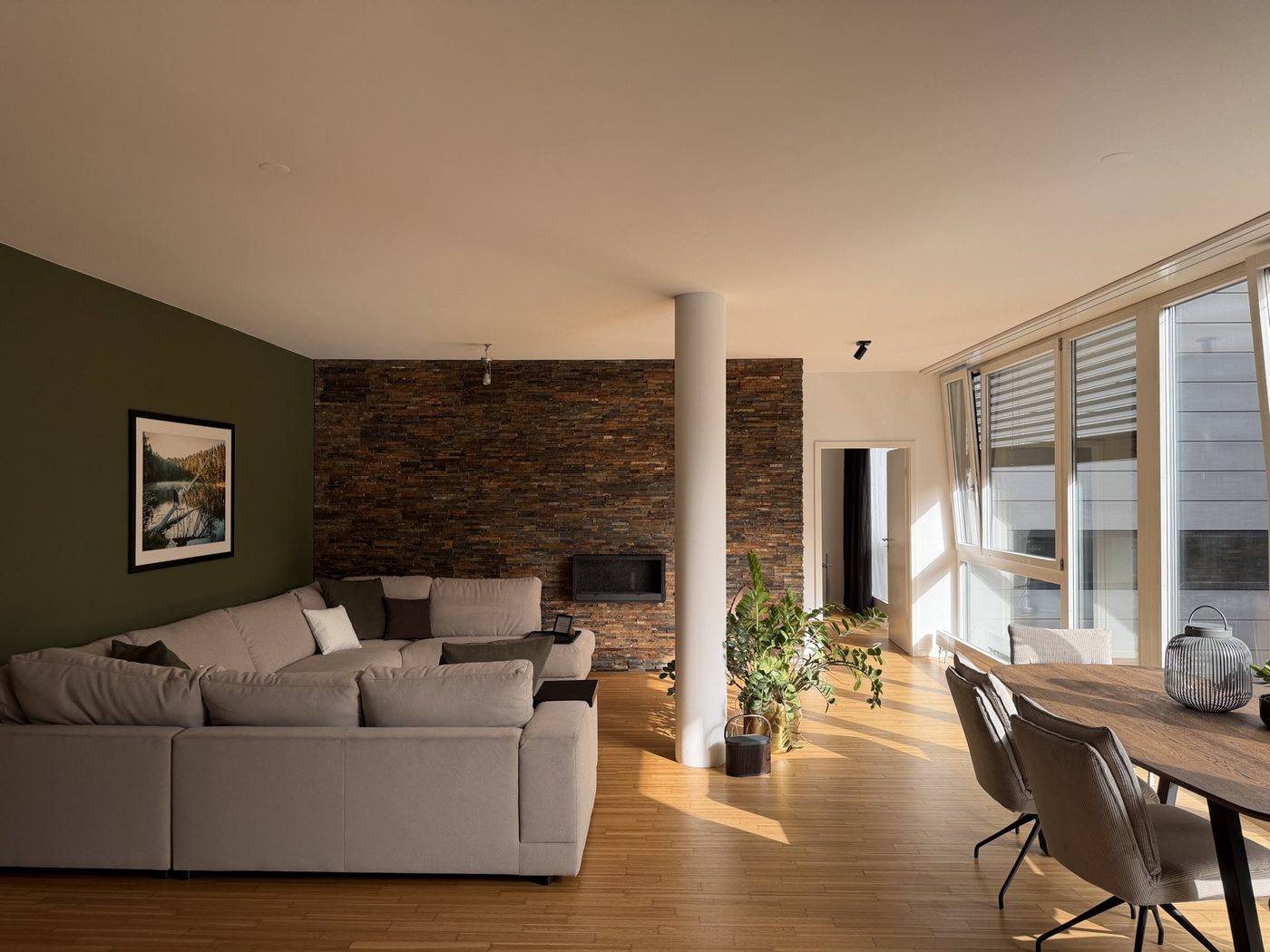 The room at Seminarzentrum Sursee, sofa, stone wall, large windows